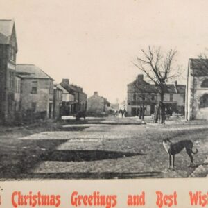 Postcard of Main Street, Kildare Town (Square) with Christmas Greetings added in red font.