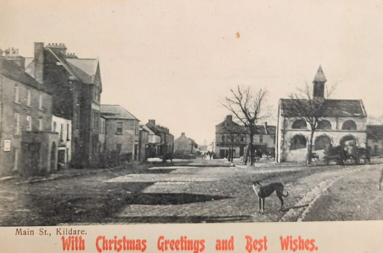 Postcard of Kildare Town in the early 20th century, with Christmas greetings included.